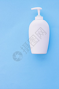 白标签化妆品容器瓶 作为蓝底产品模拟的蓝色面料洗发水肥皂护理保健液体淋浴皮肤凝胶消毒剂保湿图片