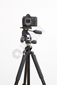 白色上隔离的三脚架数字SLR摄像机黑色爱好相机摄影商业图片