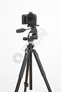 白色上隔离的三脚架数字SLR摄像机摄影商业镜片黑色相机爱好图片
