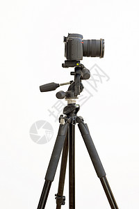 白色上隔离的三脚架数字SLR摄像机爱好摄影相机镜片商业黑色图片