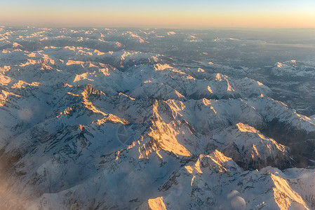 阿尔卑斯山空中冬季风景边界地形假期星星冰川天空航班天气飞行旅行图片