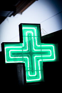 富贵的绿十字招牌建筑天空白色蓝色小时治疗医疗药品插图图片
