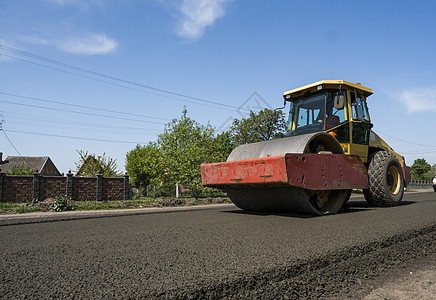 新的道路建筑工地铺设沥青路面的重振动滚滚机 修理土壤铺路柏油压缩街道工程卡车工作建造装修图片