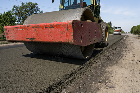 新的道路建筑工地铺设沥青路面的重振动滚滚机 修理蒸汽卡车机器工作车辆装修振动运输振动器活动图片