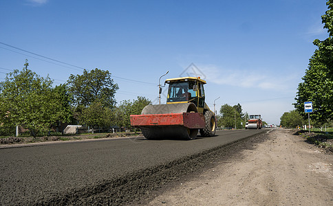 新的道路建筑工地铺设沥青路面的重振动滚滚机 修理压实街道建造压力土壤柏油装修车辆运输蒸汽图片