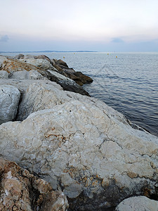 法国法国里维埃拉海岸地平线波浪日落岩石日出背景图片