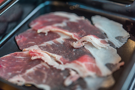 BBQ餐厅菜盘上牛肉生肉幻灯片剥皮质量盘子猪肉烹饪烧烤食物尼库美食产品图片