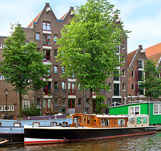 阿姆斯特丹运河和典型的荷兰住宅景观石头旅游运河建筑学首都旅行地标特丹房子图片