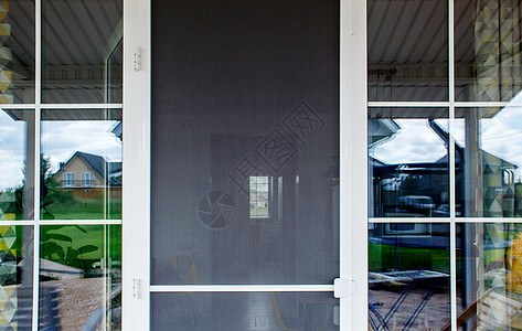 带蚊帐的塑料门白色材料玻璃金属网格昆虫框架屏幕空气建筑图片