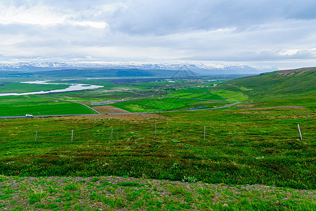 冰岛东北部的乡村地貌和景观农村旅行天空爬坡农场国家草地土地绿色旅游图片