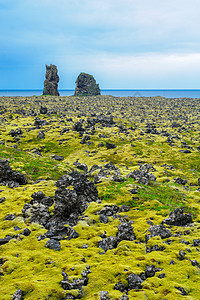 半岛火山景观戏剧性地标全景旅游土地旅行荒野海洋绿色天空图片