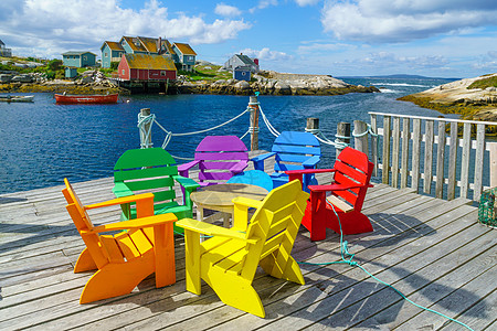 渔村佩吉湾椅子旅游沿海钓鱼支撑游客旅行海洋村庄码头图片