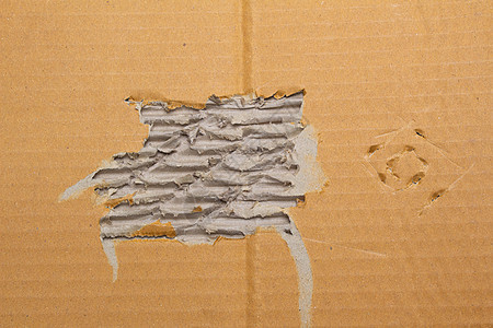 用于设计艺术作品的回收纸盒的撕破波纹棕色纸板抽象背景纹理原油废料包装材料折痕瓦楞皱纹卡片涂层框架图片