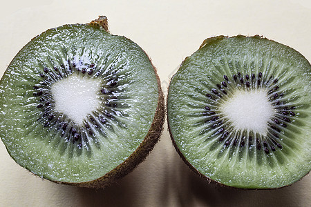 切片甜甜的维他命丰富的kiwi水果阻碍营养素矿产绿色奇异果矿物质咖啡棕色维生素图片