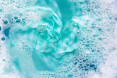 绿色白桌布 用粉末洗涤水溶解剂浸泡身体肥皂家务蓝色篮子泡沫织物洗涤剂搪瓷气泡图片