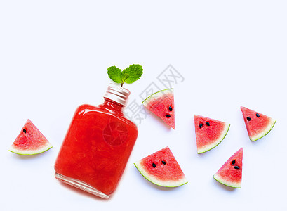 一瓶健康的西瓜汁 配有切片和薄荷叶营养水果生活薄荷食物木头饮料玻璃甜点情调图片