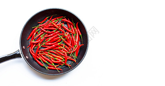 在白色背景的锅里放辣椒辣椒团体黄色美食饮食绿色胡椒食物植物红色香料图片