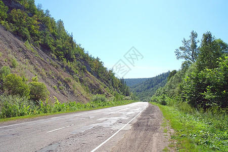 穿越山区的公路国家天空场景沥青地平线绿色土地旅行乡村蓝色图片