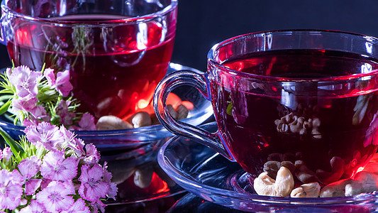 Hibiscus红茶杯 带康乃馨花花瓣覆盆子排毒疗法香味街机瓶子植物热饮时间图片