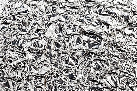 被弄皱的铝制厨房箔的质地 银色抽象背景设计材料皱纹锡纸合金床单金属包装烹饪剪裁反射图片
