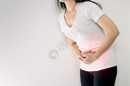 一个胃痛的月经抽筋的女人女士痛苦腹痛医疗便秘压力腹部经期疼痛身体背景图片