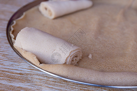 Injera 埃塞俄比亚的主食食品饼子面包文化美食盘子画眉面粉食物背景图片