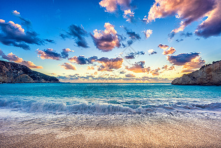 希腊列夫卡达岛的海滩日落旅游蓝色天空晴天海岸线岩石季节全景海岸悬崖图片