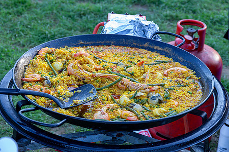 大量的海鲜肉排室外乡村贝类美食服务餐饮炊具海鲜饭黄色食物蔬菜图片