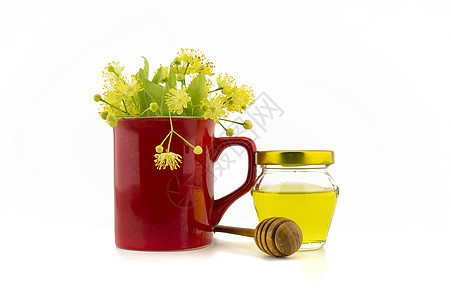 红杯中新鲜的林肯鲜花和蜂蜜茶壶树叶药品芳香椴树植物香气草药花朵饮料图片