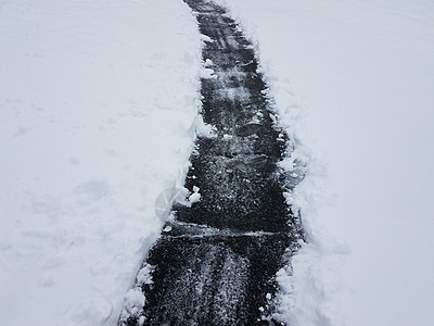 冬季有白雪铲铁铲的沥青车道天气白色寒冷小路街道沉淀图片