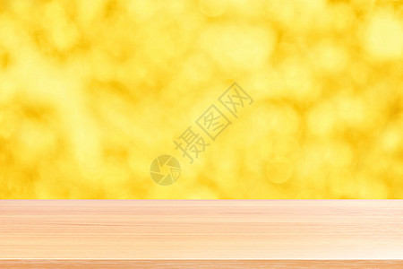 散景金黄色彩色背景上的木板 散景上的空木桌地板闪闪发光的浅金色奢华 木桌板空前闪闪发光的金色 散景照明上的木制闪闪发光的金色火花背景图片