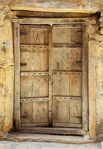 古老的古老木制门石头木头白色框架木材建筑建筑学风化入口棕色图片