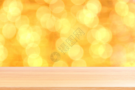 散景金黄色彩色背景上的木板 散景上的空木桌地板闪闪发光的浅金色奢华 木桌板空前闪闪发光的金色 散景照明上的木制闪闪发光的金色派对背景图片