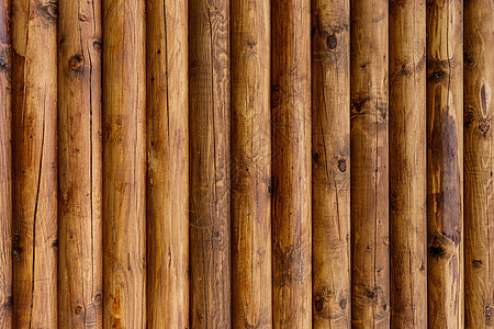 以原木为背景的木墙黄色粮食桌子控制板木材材料硬木木板衰老背景图片
