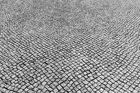 花岗岩纹理老路面地面鹅卵石灰色黑色街道小路马赛克白色材料人行道背景图片