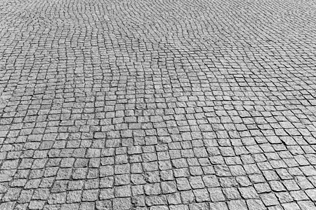 花岗岩纹理老路面材料马赛克黑色白色正方形岩石小路地面街道灰色背景图片