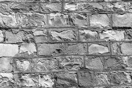 古老石墙背景 旧砖的质地花岗岩卵石建造建筑灰色圆形建筑学岩石古董黑色图片