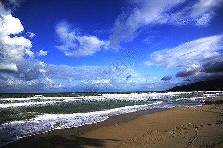 天空 海洋和沙沙海浪日出日落反射海岸旅行地平线海滩海景波浪图片