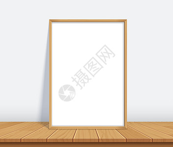 木桌上有海报模型的框架地面风格嘲笑办公室桌子木板艺术画廊长方形房间背景图片