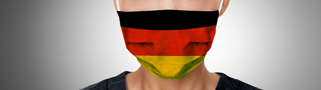 德国 COVID-19 面具标志挂在 PPE 医生身上 戴着面具全景横幅 冠状病毒大流行在德国爆发 医疗个人防护设备上的图形设计图片