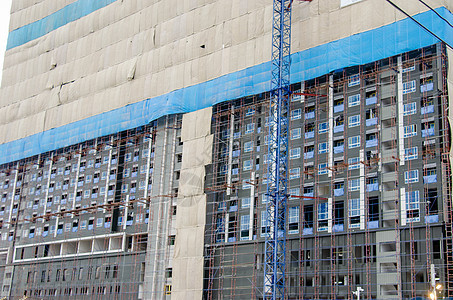 建造公用公寓楼建筑城市财产框架窗户住房水泥工程天空蓝色玻璃图片