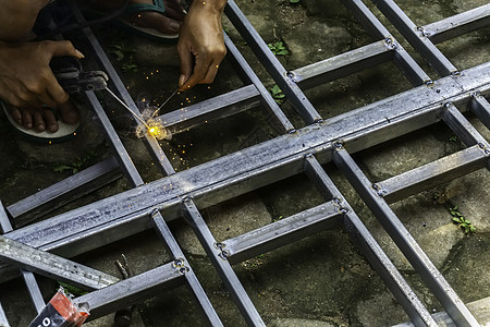 焊接钢铁结构的人的手建造制造业工业机器男士金属工人工具水平工作图片