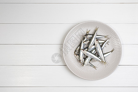 盘子上的沙丁鱼白色产品午餐钓鱼饮食海洋海鲜营养鲱鱼烹饪图片