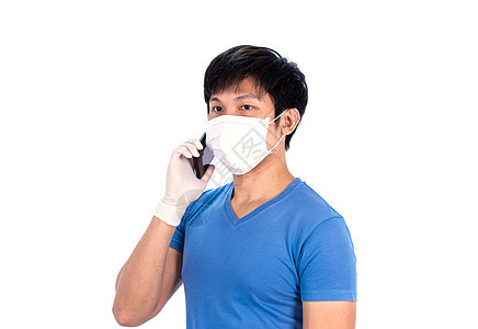 身着蓝色T恤衫顶上戴医疗面具和乳胶的亚洲青年男子流感安全卫生男性感染男人细菌疫苗手套衬衫图片