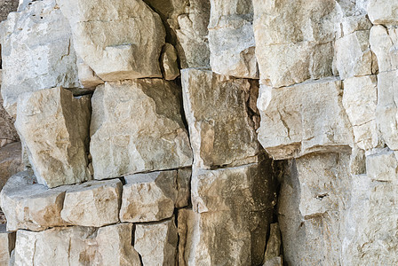 破裂的石头背景白色棕色悬崖岩石灰色石墙环境积木矿物风化图片