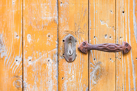 特写旧木制门建筑风化特色木头橙色艺术门把手入口装饰品乡村图片