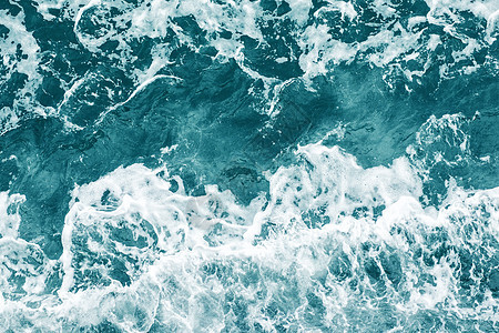 海纹和黑地的波浪海洋海景热带琥珀色蓝色气泡背景图片