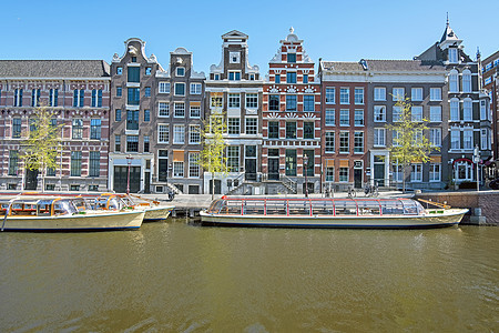 荷兰阿姆斯特丹运河沿线的中世纪住房 97运输住宅城市旅行房子旅游游船历史性游客特丹图片