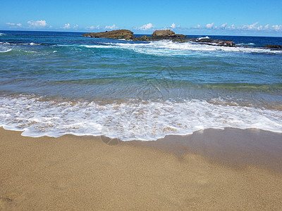 波多黎各伊莎贝拉海滩的沙浪和海浪海洋波浪海岸热带岩石图片
