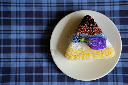 棕色 红稻草 黄蓝咖啡卷米食物黄色白色蝴蝶红花红色芝麻背景图片